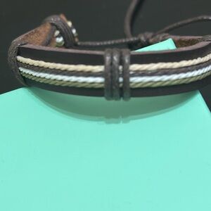 Brand new. Mens Leather three layered stripe bracelet. Adjustable. 7.5-12 inches